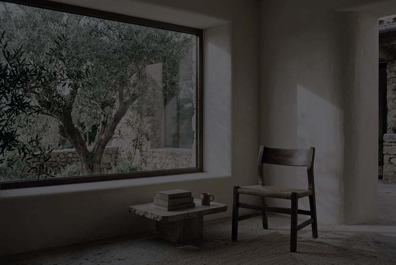 A sunlit reading room with warm plaster walls